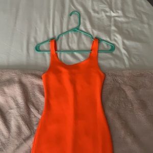 neon orange tight fitting dress from tiger mist